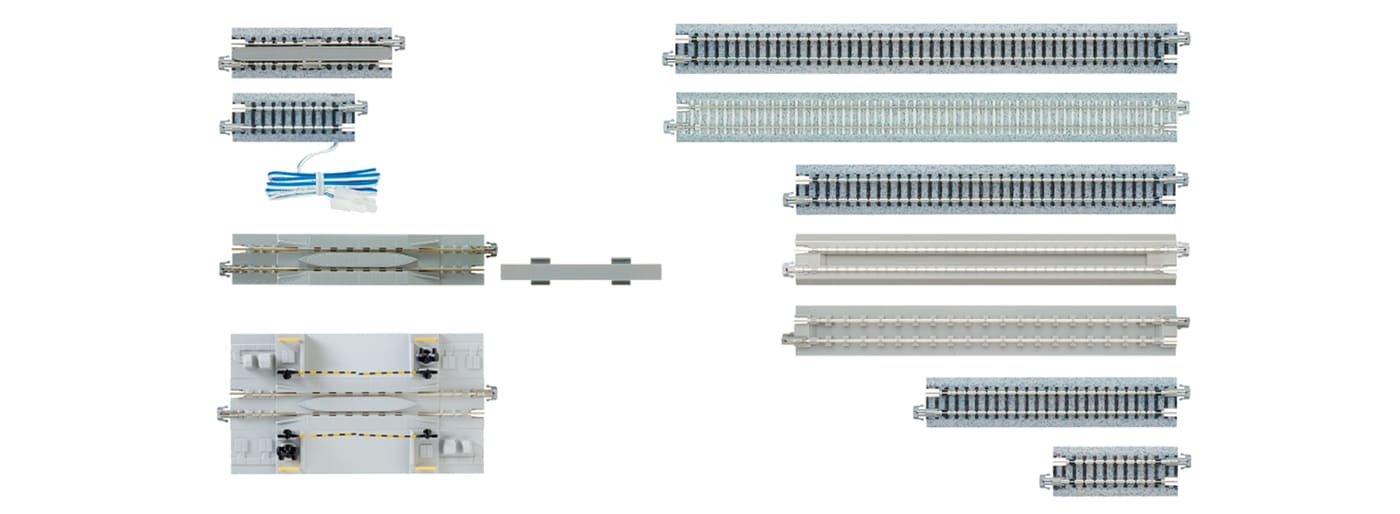KATO Unitrack straight sections of various lengths laid side by side, grey roadbed
