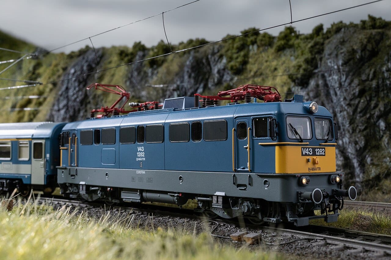 Piko HO V43 electric locomotive on a layout track under overhead wire