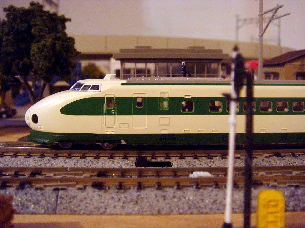 TOMIX N-scale 200 series Shinkansen, white with a green band, on a layout